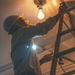 Electrician changing a light bulb while doing household tasks